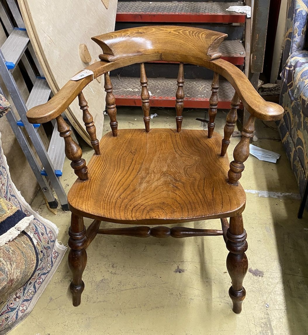 A Victorian beech and elm smoker's bow chair